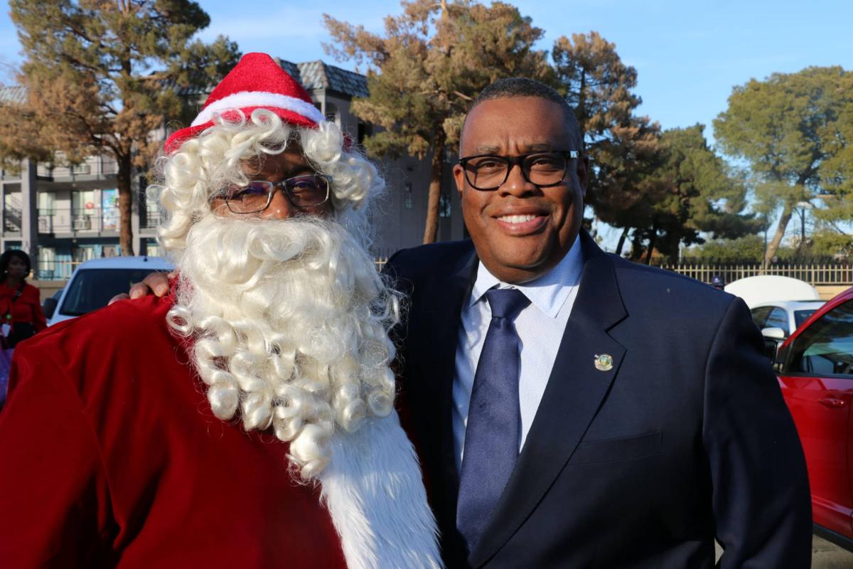 Thumpa Claus and Ward 5 City Councilman Cedric Crear before the toy drop off.